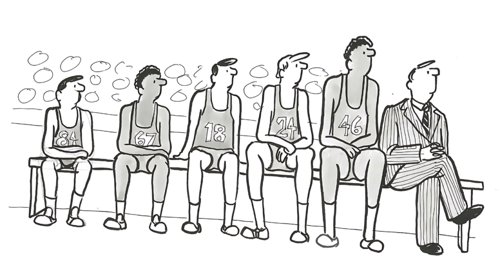 Basketball Players Sitting on the Bench.